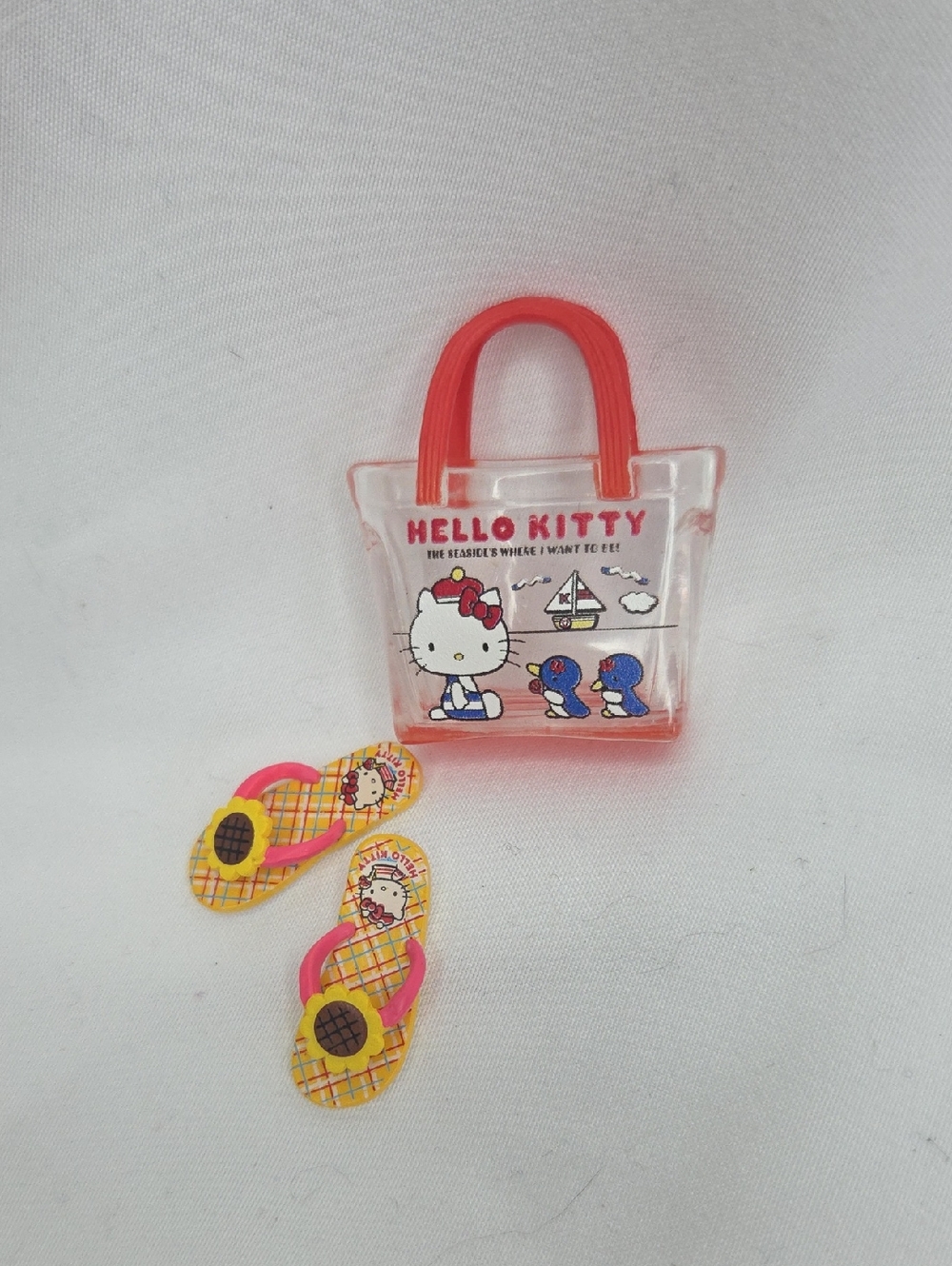 Hello Kitty Clear Mini Tote with Red Handles and Yellow Pink Flip-Flop Charms